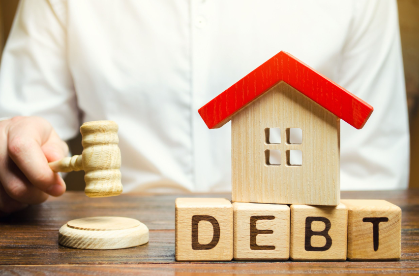 Sprzedaż nieruchomości z długiem - jak tego dokonać?